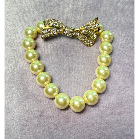 Kenneth Jay Lane Jewelry - Kenneth Jay Lane KJL Cream Stretch Pearl Bracelet Rhinestones Encrusted Bow Gold